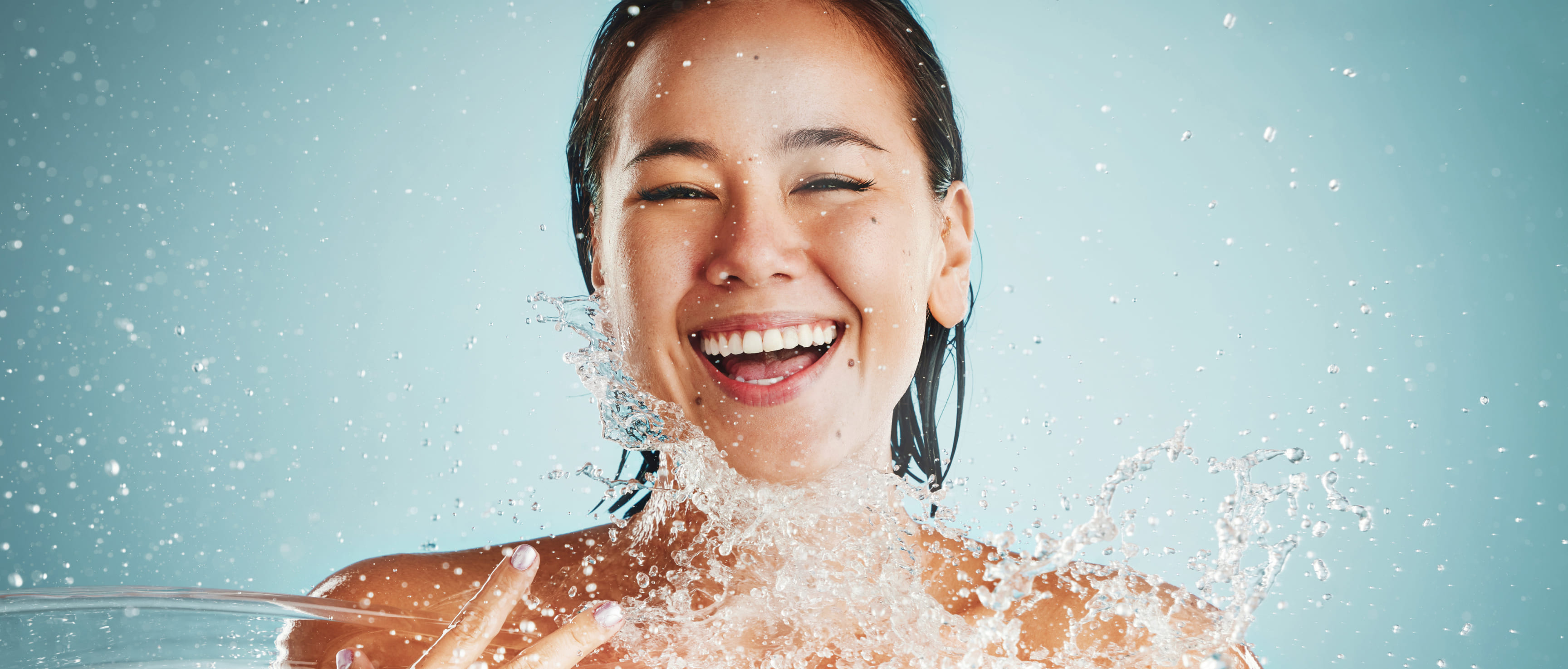 happy woman washing face