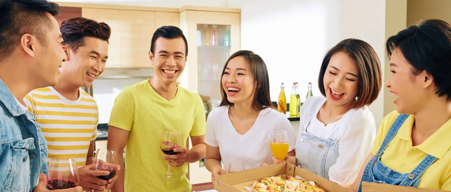 happy friends eating pizza